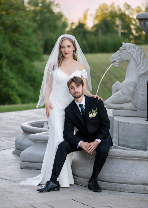 Beautiful image of wedding couple with fountain behind