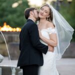 Gallery image of Beautiful image of wedding couple with romatic kiss and sunlit background