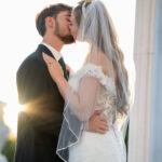 Gallery image of Beautiful image of wedding couple with romatic kiss and sunlit background