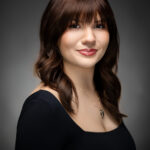 Gallery image of Professional headshot of attractive brown haired woman